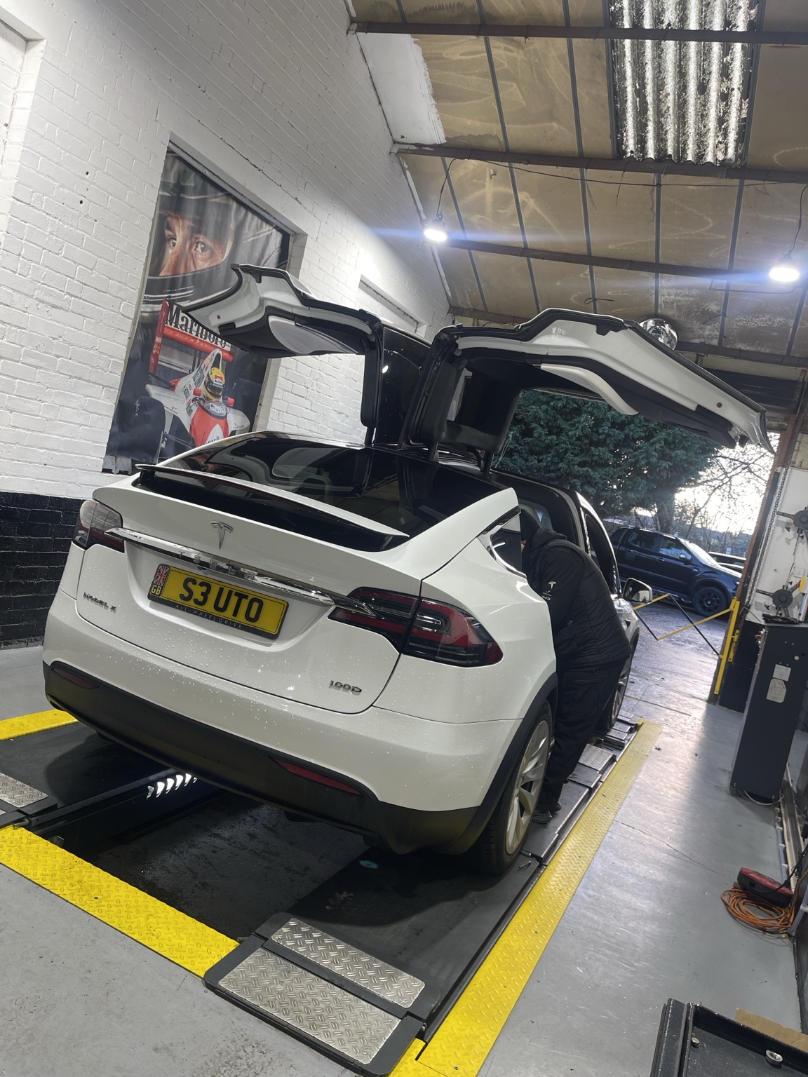 Tesla Model X being inspected in the workshop